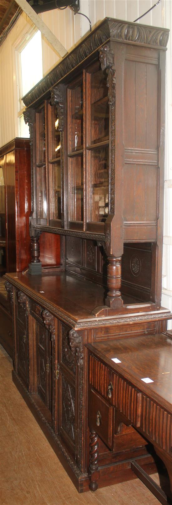 Carved oak glazed bookcase